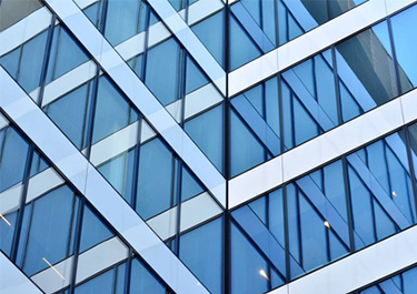 五种玻璃幕墙固定方式深度解析